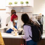 Student receiving order at Blue Donkey